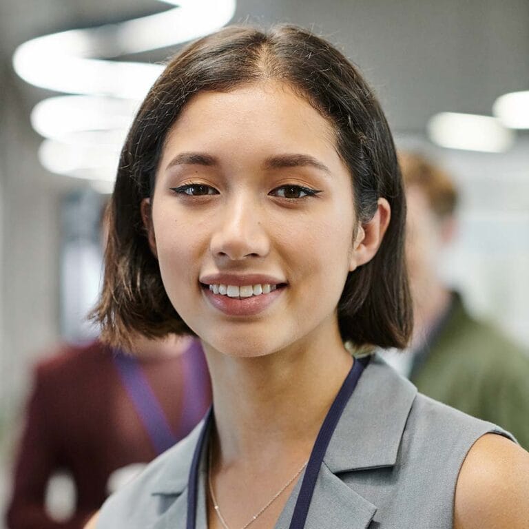 Professional Melbourne Tech Institute graduate smiling in the workplace