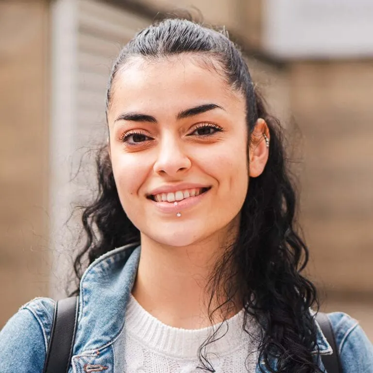 Smiling Melbourne Tech Institute student looking to camera